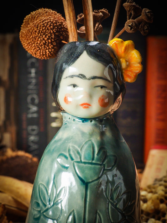 Original handmade ceramic flower vase, artist brush and pencil holder by Idania Salcido, Danita Art. Frida Kahlo with flowers in her head and sgraffito body details. Handmade touch to any artist's studio with handmade glazed ceramic good for watercolors acrylics inks and oil paints. Clean with water or mineral spirits.