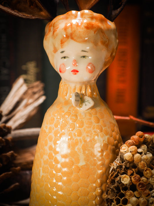 Original handmade ceramic flower vase, artist brush and pencil holder by Idania Salcido, Danita Art. A honeycomb bee shaped statue with china doll head. Handmade touch to any artist's studio with handmade glazed ceramic good for watercolors acrylics inks and oil paints. Clean with water or mineral spirits.