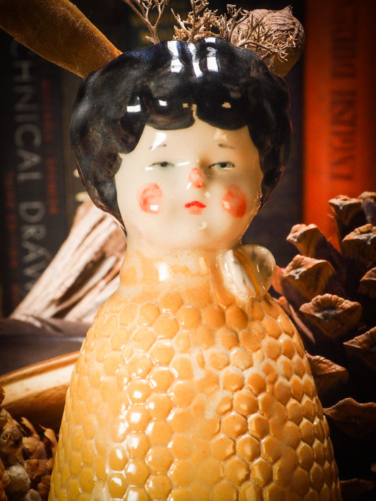 Original handmade ceramic flower vase, artist brush and pencil holder by Idania Salcido, Danita Art. A honeycomb bee shaped statue with china doll head. Handmade touch to any artist's studio with handmade glazed ceramic good for watercolors acrylics inks and oil paints. Clean with water or mineral spirits.