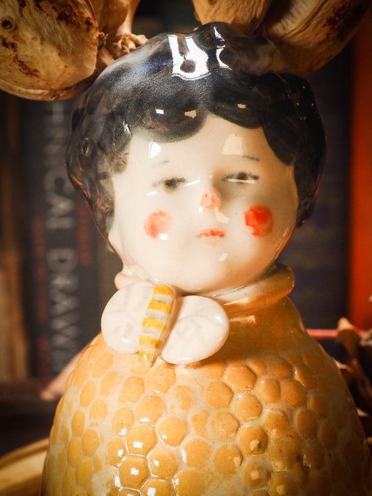 Original handmade ceramic flower vase, artist brush and pencil holder by Idania Salcido, Danita Art. A honeycomb bee shaped statue with china doll head. Handmade touch to any artist's studio with handmade glazed ceramic good for watercolors acrylics inks and oil paints. Clean with water or mineral spirits.