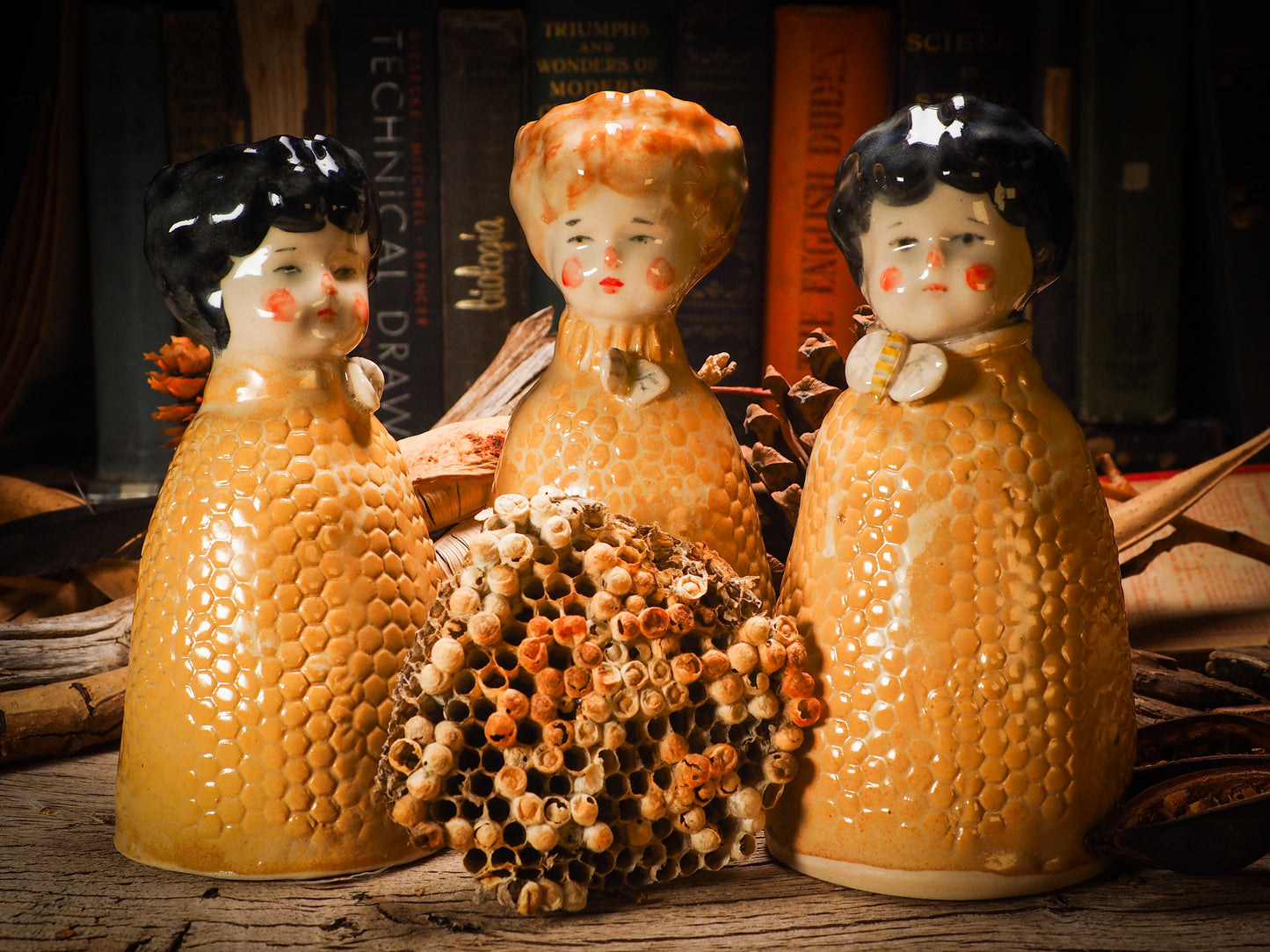 Original handmade ceramic flower vase, artist brush and pencil holder by Idania Salcido, Danita Art. A honeycomb bee shaped statue with china doll head. Handmade touch to any artist's studio with handmade glazed ceramic good for watercolors acrylics inks and oil paints. Clean with water or mineral spirits.