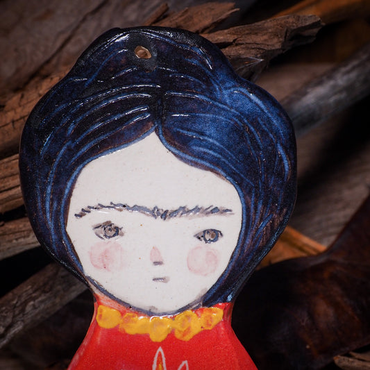 An original Christmas Holiday tree glazed ceramic ornament handmade by Idania Salcido, the artist behind Danita Art. Glazed carved sgraffito stoneware, hand painted and decorated, it is illustrated by hand with Frida Kahlo, Mexican motifs and bold, bright and colorful ceramic glazes.