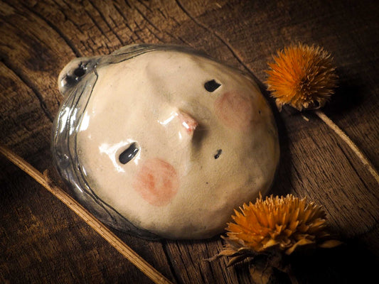 You are looking at an original handmade ceramic hanging face figurine by Idania Salcido, the artist behind Danita Art. Each one is a unique work of art on itself, designed and hand built by me, Idania Salcido. It will add a beautiful handmade touch to any artist's studio, and it's cute details will let your inspiration flow freely.