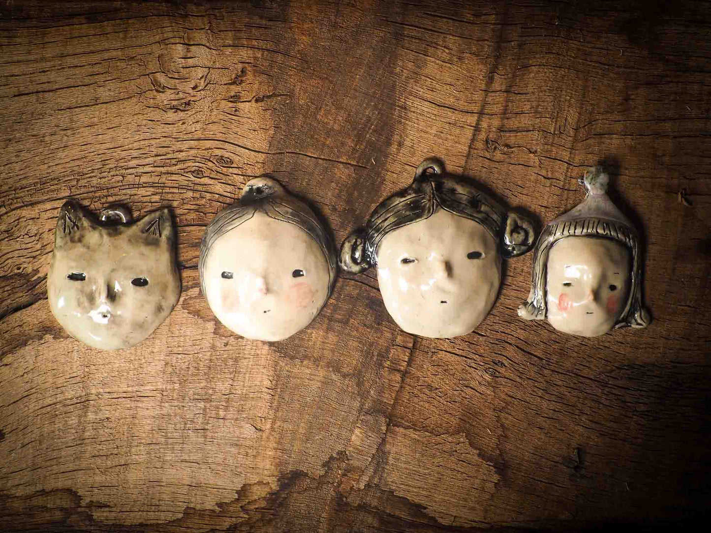 You are looking at an original handmade ceramic hanging face figurine by Idania Salcido, the artist behind Danita Art. Each one is a unique work of art on itself, designed and hand built by me, Idania Salcido. It will add a beautiful handmade touch to any artist's studio, and it's cute details will let your inspiration flow freely.