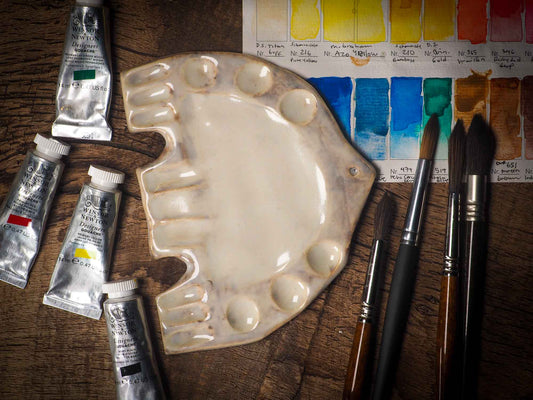 Each artist paint glazed ceramic palette by Idania Salcido, the artist behind Danita Art, is hand sculpted and fired with paint and scratch resistant glazes and with enough paint wells to keep and mix colors at ease. Acrylics, Oils and watercolors can be used, it is perfect for any medium! Clean with water or mineral spirits.