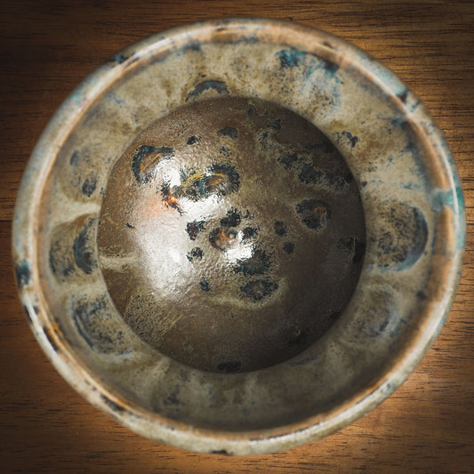 An original Idania Salcido Danita Art pinched ceramic cat pet food plate. Handmade from stoneware, this glazed ceramics one of a kind artwork is perfect for any kitchen plate and bowls unique collection. Thumbprints and intentionally irregular shape give the bowl a cozy, warmly familiar feel when you pick it. A cute little black cat and a home is painted in underglaze.