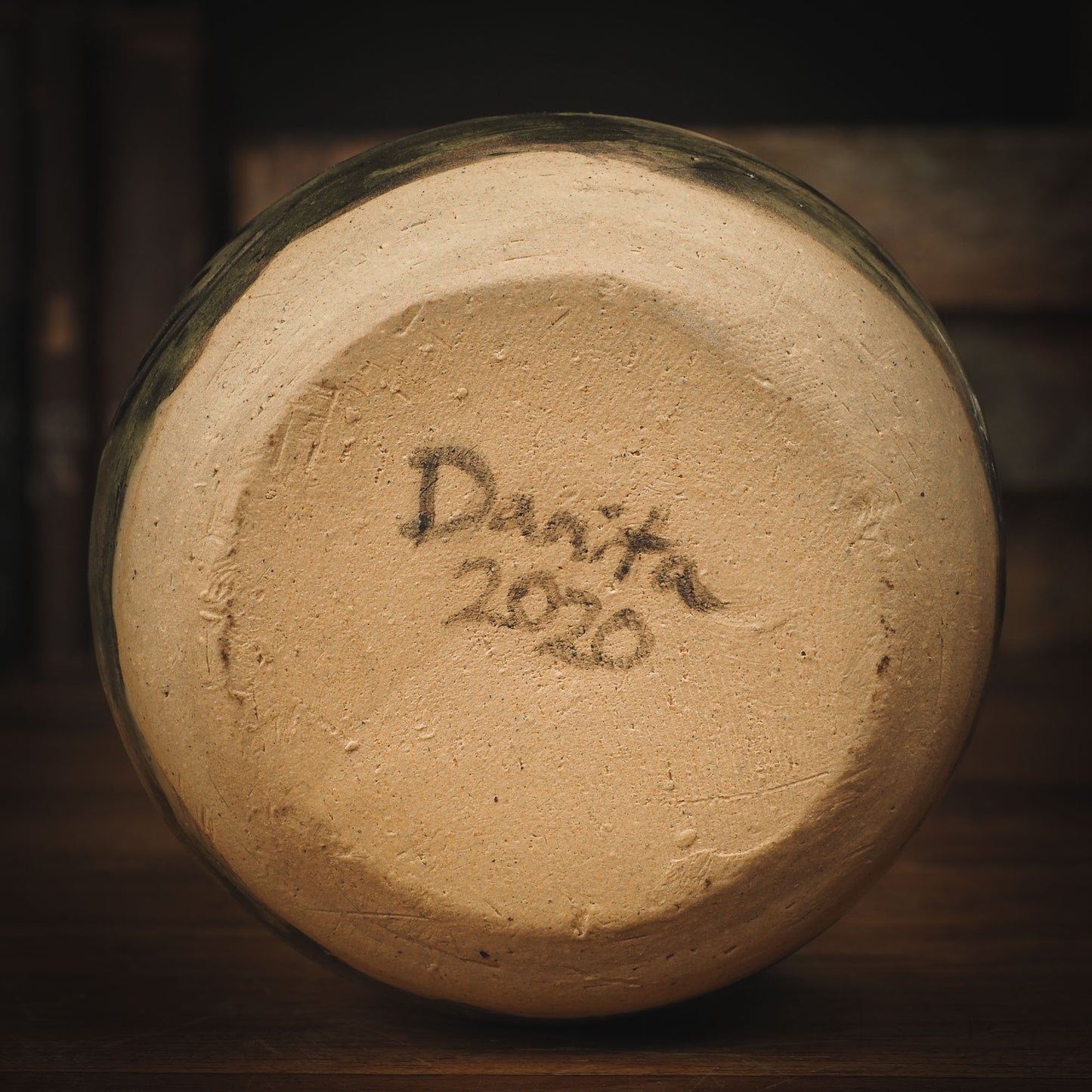 An original Idania Salcido Danita Art pinched ceramic cat pet food plate. Handmade from stoneware, this glazed ceramics one of a kind artwork is perfect for any kitchen plate and bowls unique collection. Thumbprints and intentionally irregular shape give the bowl a cozy, warmly familiar feel when you pick it. A cute little black cat and a home is painted in underglaze.