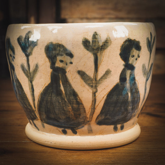 An original Idania Salcido Danita Art pinched ceramic cat pet food plate. Handmade from stoneware, this glazed ceramics one of a kind artwork is perfect for any kitchen plate and bowls unique collection. Thumbprints and intentionally irregular shape give the bowl a cozy, warmly familiar feel when you pick it. Flowers and girls painted in underglaze make this a beautiful unique piece.