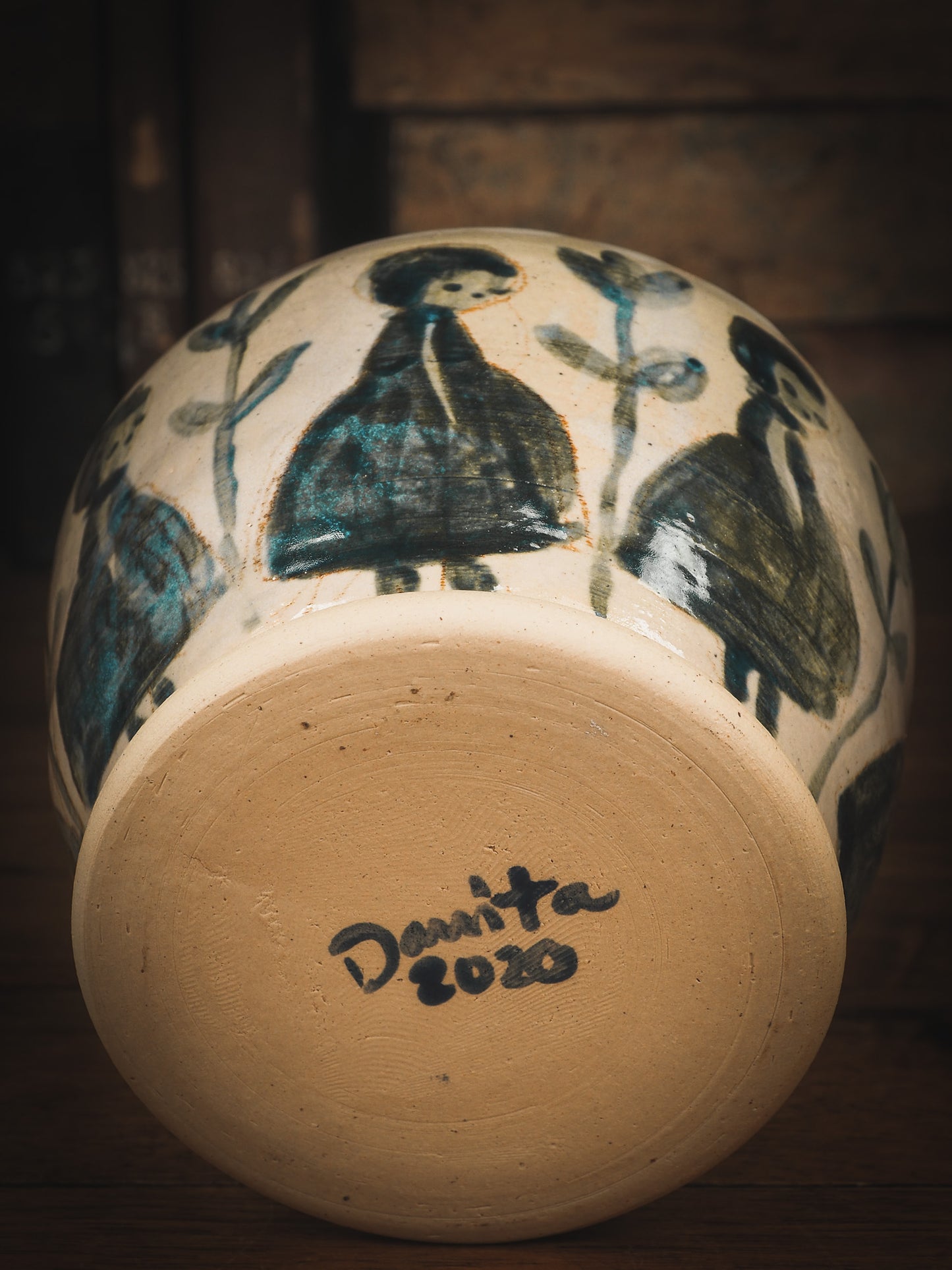 An original Idania Salcido Danita Art pinched ceramic cat pet food plate. Handmade from stoneware, this glazed ceramics one of a kind artwork is perfect for any kitchen plate and bowls unique collection. Thumbprints and intentionally irregular shape give the bowl a cozy, warmly familiar feel when you pick it. Flowers and girls painted in underglaze make this a beautiful unique piece.