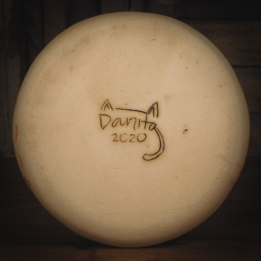 An original Idania Salcido Danita Art pinched ceramic cat pet food plate. Handmade from stoneware, this glazed ceramics one of a kind artwork is perfect for any kitchen plate and bowls unique collection. Thumbprints and intentionally irregular shape give the bowl a cozy, warmly familiar feel when you pick it. A cute little cat hiding in flowers is carved on the sides.