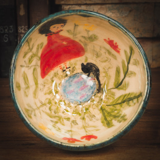 An original Idania Salcido Danita Art pinched ceramic cat pet food plate. Handmade from stoneware, this glazed ceramics one of a kind artwork is perfect for any kitchen plate and bowls unique collection. Thumbprints and intentionally irregular shape give the bowl a cozy, warmly familiar feel when you pick it. A beautiful cute cat is playing with his girl friend on an underglaze watercolor pond.