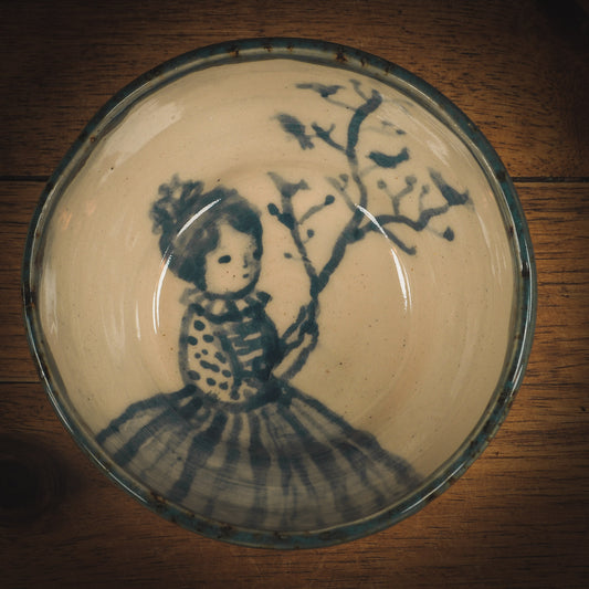 An original Idania Salcido Danita Art ceramic cat pet food plate. Handmade from stoneware, this glazed ceramics one of a kind artwork is perfect for any kitchen plate and bowls unique collection. Thumbprints and intentionally irregular shape give the bowl a cozy, warmly familiar feel when you pick it. Birds in a tree and a beautiful girl painted in blue underglaze make this a beautiful unique piece.