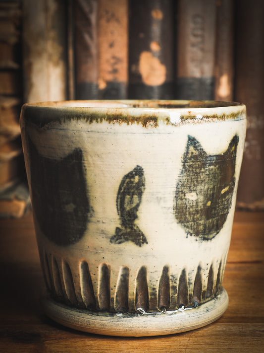 An original Idania Salcido Danita Art ceramic cat pet food plate. Handmade from stoneware, this glazed ceramics one of a kind artwork is perfect for any kitchen plate and bowls unique collection. Thumbprints and intentionally irregular shape give the bowl a cozy, warmly familiar feel when you pick it. Black cats guard your favorite drink. They are perfect to guard evil spirits at night too!