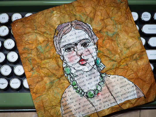 Freehand embroidery painting by Danita Art. Sewing using free motion stitching and embroidery, Danita created a beautiful textile and fabric art original artwork with famous Mexican artist Frida Kahlo featured in a one of a kind portrait.