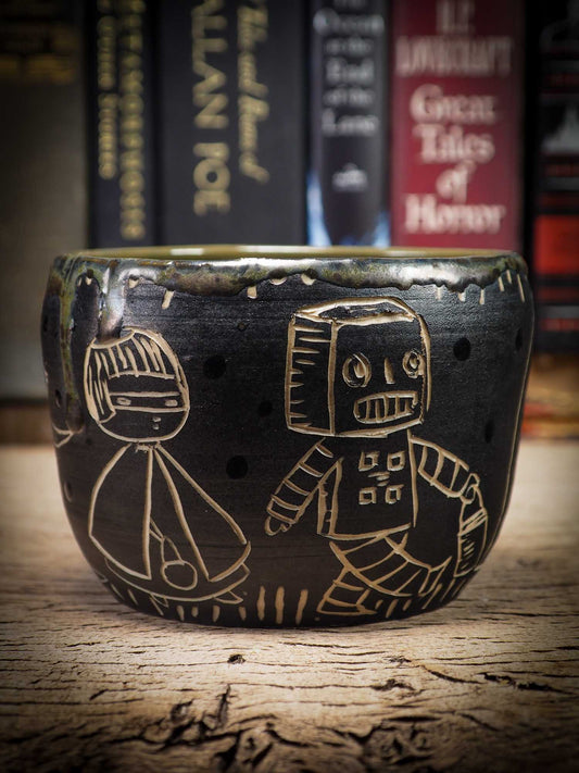 An original Halloween ceramic bowl by Idania Salcido, the artist behind Danita Art. Measures 4 x 4 x 3 Inches, made with wheel thrown clay, hand carved and glazed by the artist. The carved figures give it a nice, folk art primitive feel to it. Perfect for Halloween Candy, ice cream and fruit and as pet cat bowl.