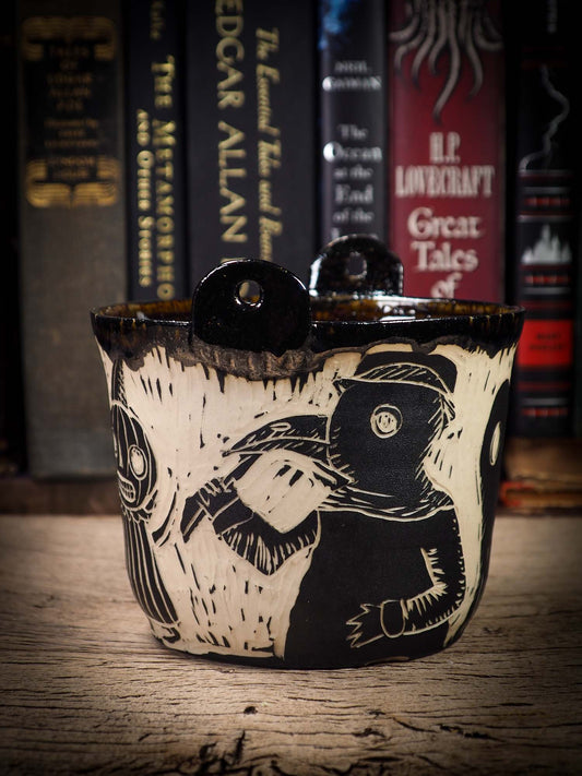 An original Halloween ceramic bowl by Idania Salcido, the artist behind Danita Art. Made with wheel thrown clay, hand carved and glazed by the artist. The carved witches, ghosts, goblins, plague doctors and vampires give it a nice, folk art primitive feel to it. Perfect for Halloween Candy, ice cream and fruit and as pet cat bowl.