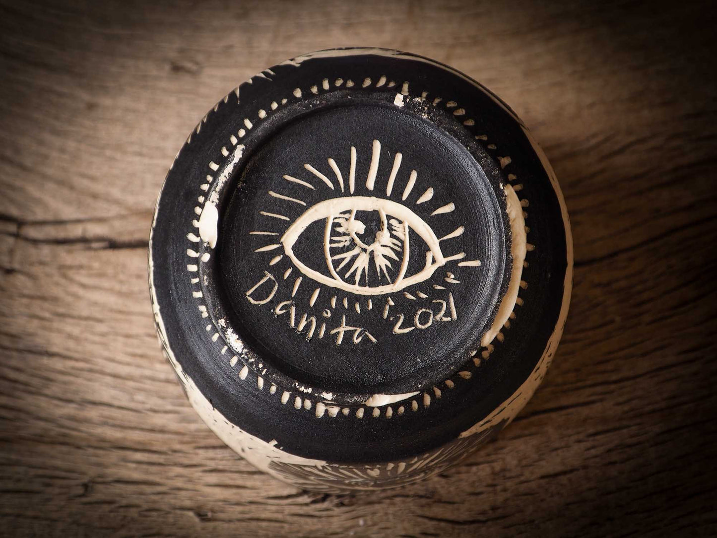 An original Halloween ceramic bowl by Idania Salcido, the artist behind Danita Art. Made with wheel thrown clay, hand carved and glazed by the artist. The carved witches, ghosts, goblins and vampires give it a nice, folk art primitive feel to it. Perfect for Halloween Candy, ice cream and fruit and as pet cat bowl.