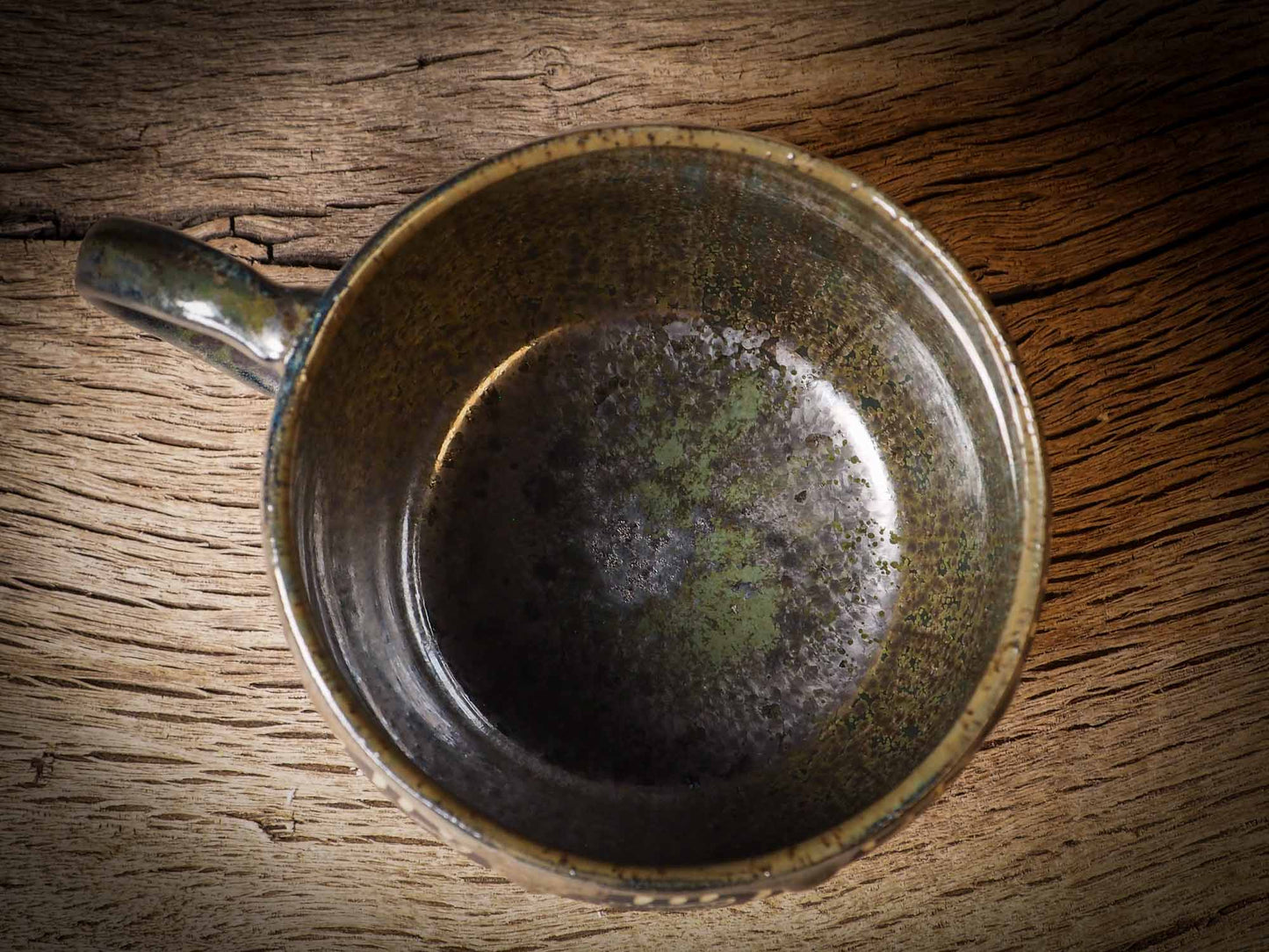 An original Halloween ceramic coffee mug bowl by Idania Salcido, the artist behind Danita Art. Made with wheel thrown clay, hand carved and glazed by the artist. The carved witches, ghosts, goblins and vampires give it a nice, folk art primitive feel to it. Perfect for Halloween Candy, ice cream and fruit and as pet cat bowl.