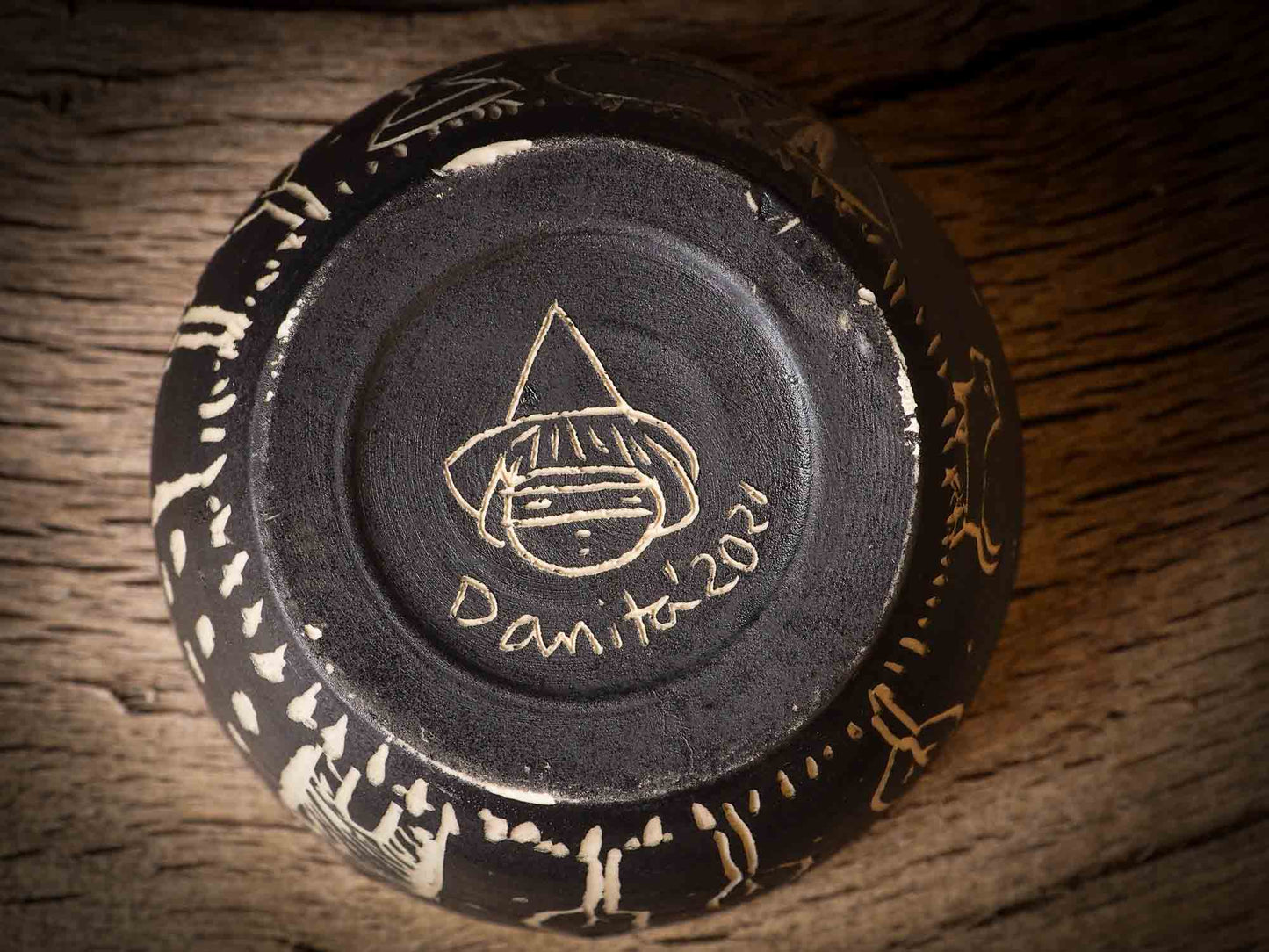 An original Halloween ceramic tumbler bowl by Idania Salcido, the artist behind Danita Art. Made with wheel thrown clay, hand carved and glazed by the artist. The carved witches, ghosts, goblins and vampires give it a nice, folk art primitive feel to it. Perfect for Halloween Candy, ice cream and fruit, a pet cat bowl.