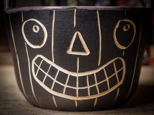 An original Halloween ceramic bowl bucket pail handmade by Idania Salcido the artist behind Danita Art. Made with wheel thrown clay hand carved and glazed by the artist. Witches, ghosts, goblins, black cats, vampires give a folk art primitive feel to it. Perfect for Halloween Candy, ice cream and fruit, a pet cat bowl.