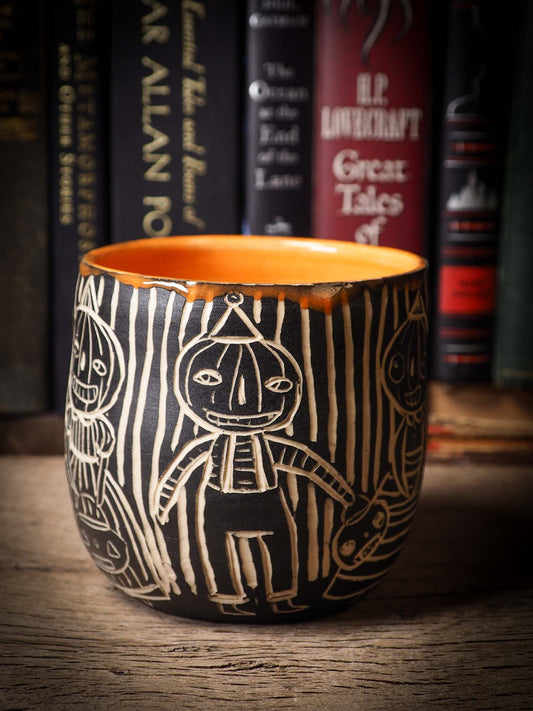 An original Halloween ceramic bowl bucket pail handmade by Idania Salcido the artist behind Danita Art. Made with wheel thrown clay hand carved and glazed by the artist. Witches, ghosts, goblins, black cats, vampires give a folk art primitive feel to it. Perfect for Halloween Candy, ice cream and fruit, a pet cat bowl.