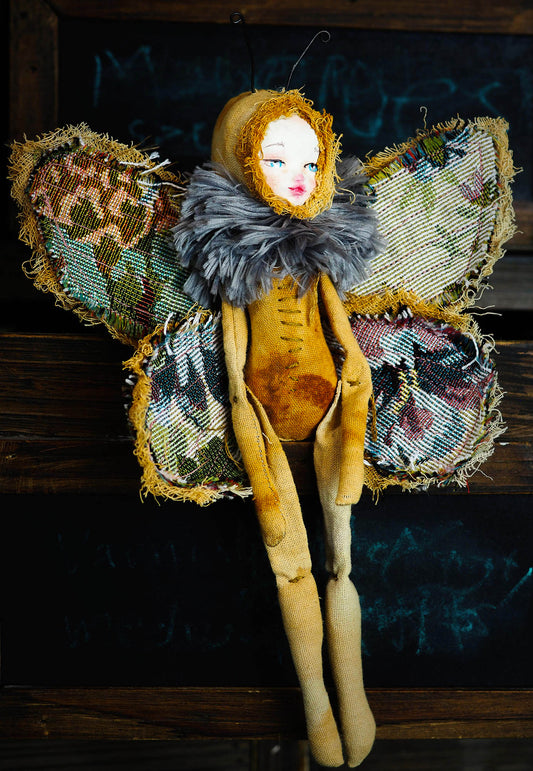 Inspired by nature, Danita created a handmade art doll moth, or night butterfly using organic materials like vintage and hand dyed fabric, wire and clay on a melancholic articulated soft sculpture. An art doll toy that celebrates nature's creations and the beautiful wings of insects with a bit of magic fairy on them.