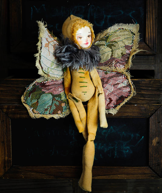 Inspired by nature, Danita created a handmade art doll moth, or night butterfly using organic materials like vintage and hand dyed fabric, wire and clay on a melancholic articulated soft sculpture. An art doll toy that celebrates nature's creations and the beautiful wings of insects with a bit of magic fairy on them.