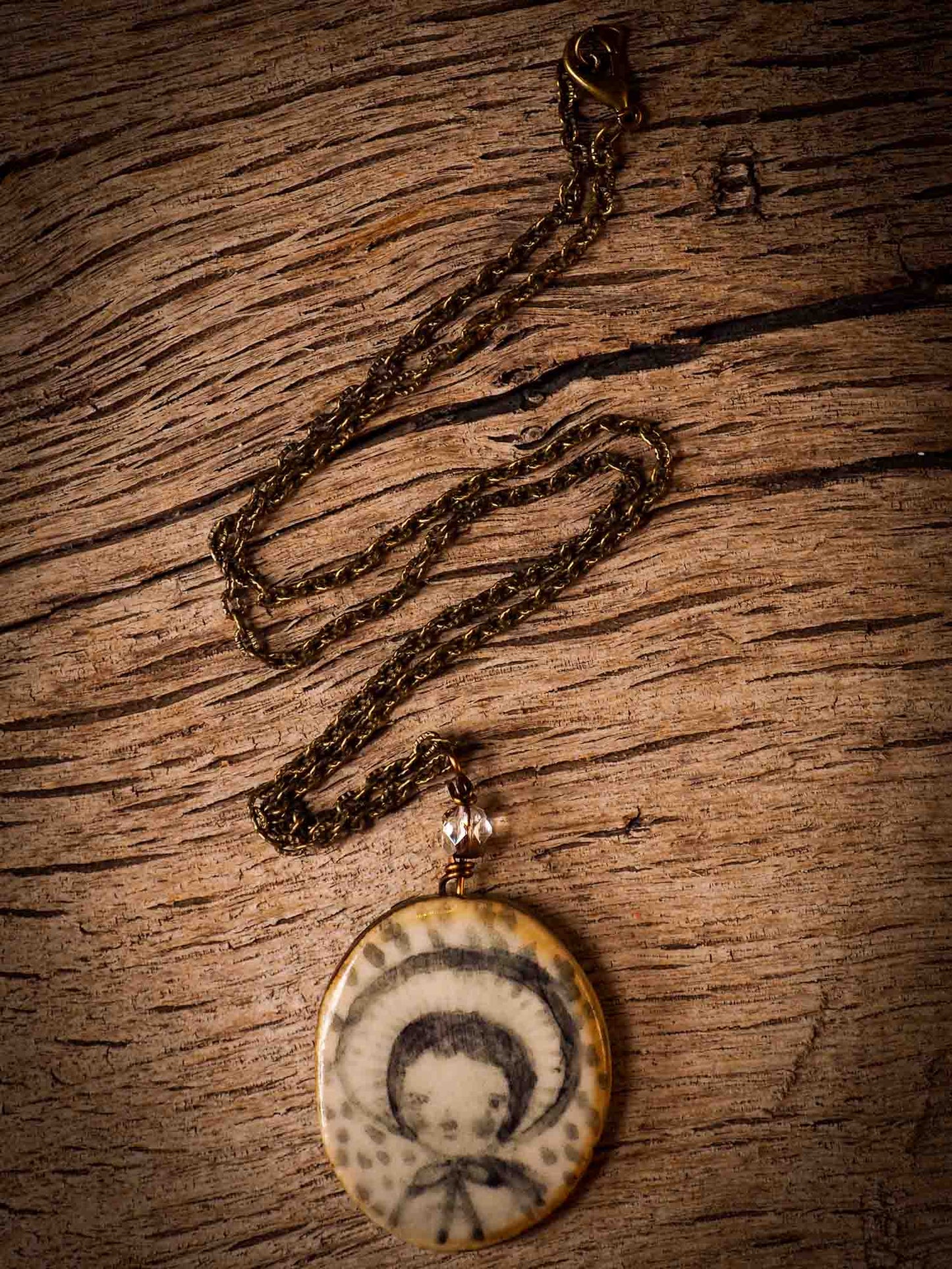 Unique fired ceramic porcelain necklace oval pendant by Idania Salcido, the artist behind Danita Art. Each jewelry setting is hand drawn and illustrated by the artist in her art studio, perfect for any dressing style. A casual gathering with friends or a fancy formal dinner, this necklace is a perfect fashion accessory