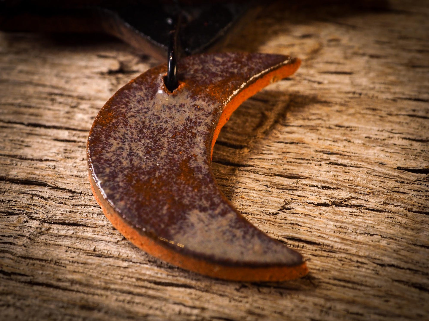 An original handmade Halloween ornament by Idania Salcido, Danita Art. Each ornament is hand carved with pumpkins, witches, cats, jack-o-lanterns and moons. Made with fired glazed ceramics, this little witch, jack-o-lantern and cat is carved with delicate patterns that make each ornament a one of a kind work of art.