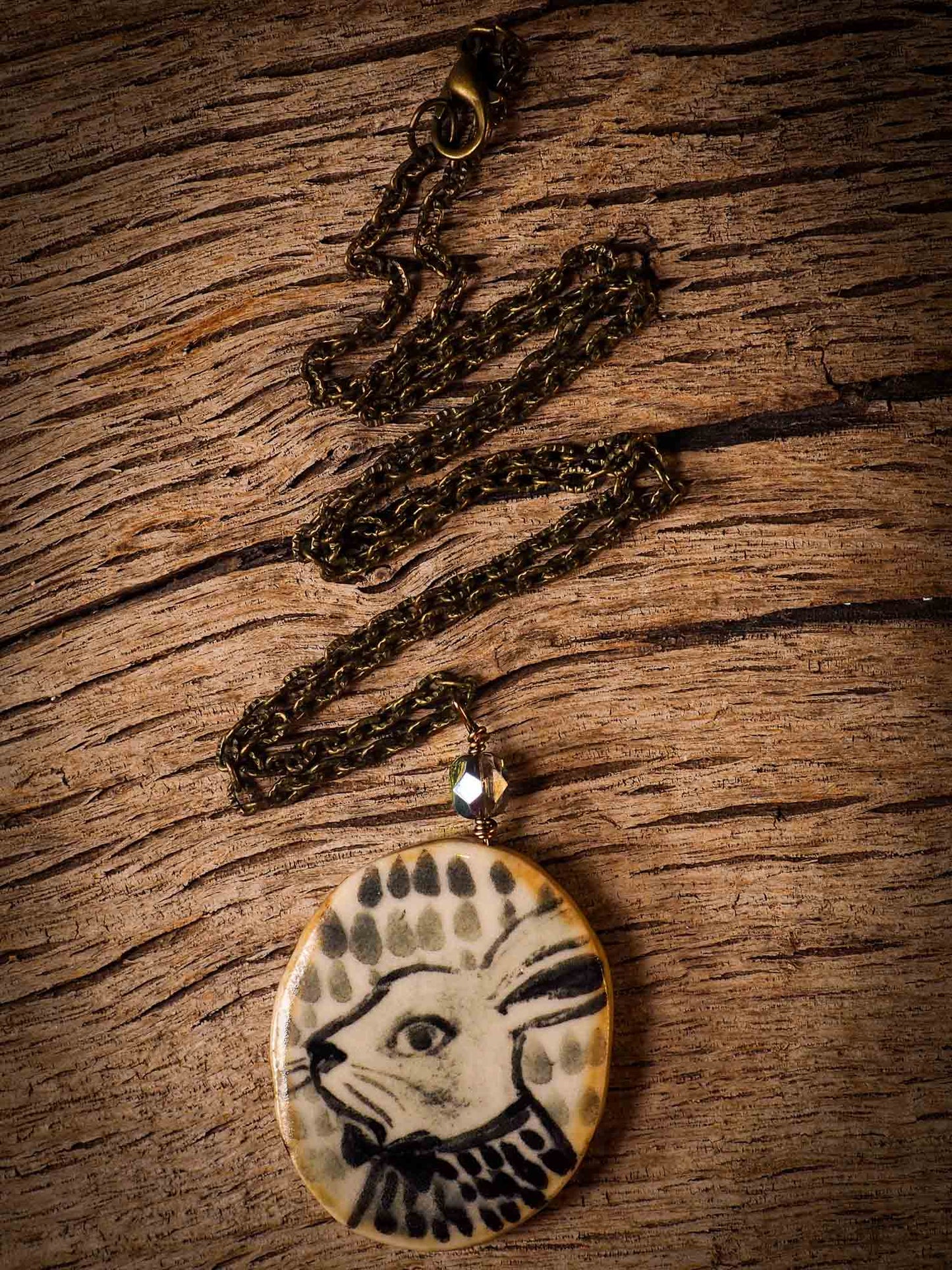 Unique fired ceramic porcelain necklace oval pendant by Idania Salcido, the artist behind Danita Art. Each jewelry setting is hand drawn and illustrated by the artist in her art studio, perfect for any dressing style. A casual gathering with friends or a fancy formal dinner, this necklace is a perfect fashion accessory.