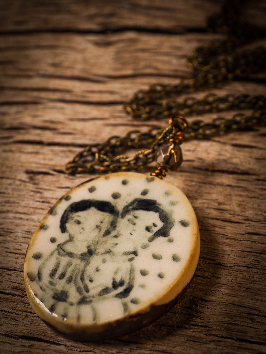 Unique fired ceramic porcelain necklace oval pendant by Idania Salcido, the artist behind Danita Art. Each jewelry setting is hand drawn and illustrated by the artist in her art studio, perfect for any dressing style. A casual gathering with friends or a fancy formal dinner, this necklace is a perfect fashion accessory.
