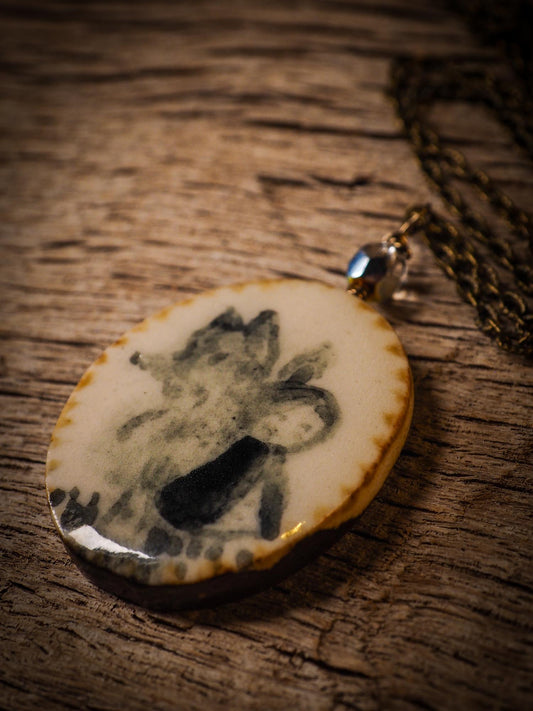 Unique fired ceramic porcelain necklace oval pendant by Idania Salcido, the artist behind Danita Art. Each jewelry setting is hand drawn and illustrated by the artist in her art studio, perfect for any dressing style. A casual gathering with friends or a fancy formal dinner, this necklace is a perfect fashion accessory.