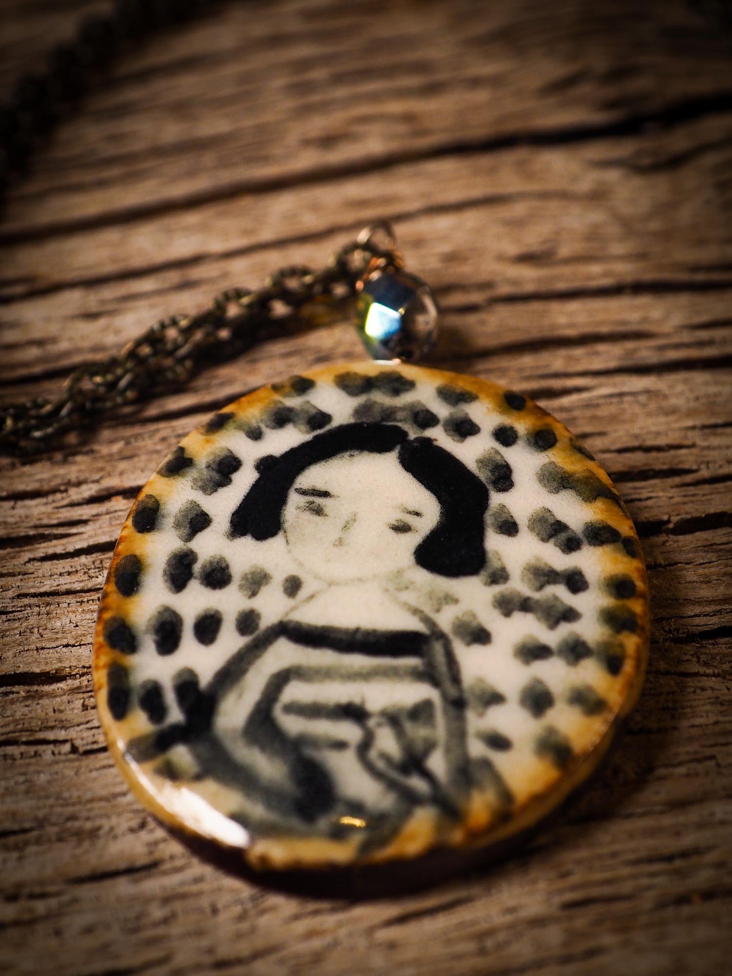 Unique fired ceramic porcelain necklace oval pendant by Idania Salcido, the artist behind Danita Art. Each jewelry setting is hand drawn and illustrated by the artist in her art studio, perfect for any dressing style. A casual gathering with friends or a fancy formal dinner, this necklace is a perfect fashion accessory.