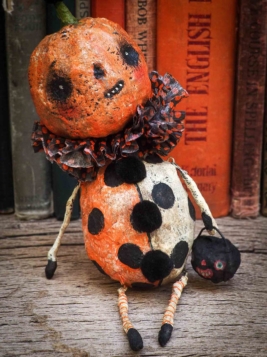 Danita Art thought about the Christmas carol story and decided to make a Halloween version with ghosts, ghouls, pumpkins, jack-o-lanterns, witches, cauldrons and more night creatures. This handmade art doll ornament for Christmas or Halloween trees is made with Spun cotton and paper clay,