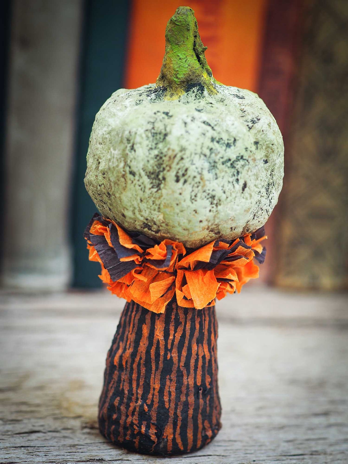 Orange and green Halloween pumpkin kawaii kokeshi mini art doll by Danita Art. Spun cotton, handmade miniature doll to decorate in Halloween.