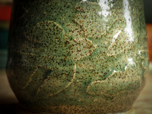 An original glazed ceramic jar by Idania Salcido, the artist behind Danita Art. It measures 2.5 x 2.5 x 3.5 Inches, with deep green hue glazes and hand decorated figures on the sides. Totally handmade in my studio, this is a unique piece that cannot be repeated. Food and drink safe, hand wash only.