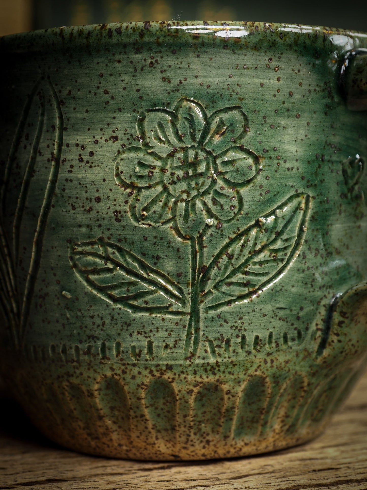 An original glazed ceramic mug by Idania Salcido, the artist behind Danita Art. It measures 3 x 3 x 3 Inches, with deep green hue glazes and hand decorated figures on the sides. Totally handmade in my studio, this is a unique piece that cannot be repeated. Food and drink safe, hand wash only.