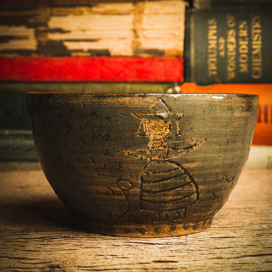 An original handmade fired stoneware ceramic art piece by Idania Salcido, the artist behind Danita Art. A Halloween themed bowl perfect for enjoying ice cream, hot coffee or a delicious hot cocoa with carved primitive witches and cats. Danita's exclusive line of housewares and hand made home decor will create beautiful memories for you.