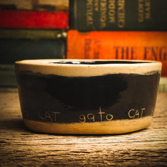 An original handmade fired stoneware ceramic art piece by Idania Salcido, the artist behind Danita Art. A Halloween themed bowl perfect for enjoying ice cream and fruit slices, or to be used as a fancy, one of a kind pet food bowl. Danita's exclusive line of housewares and hand made home decor will create beautiful memories for you.