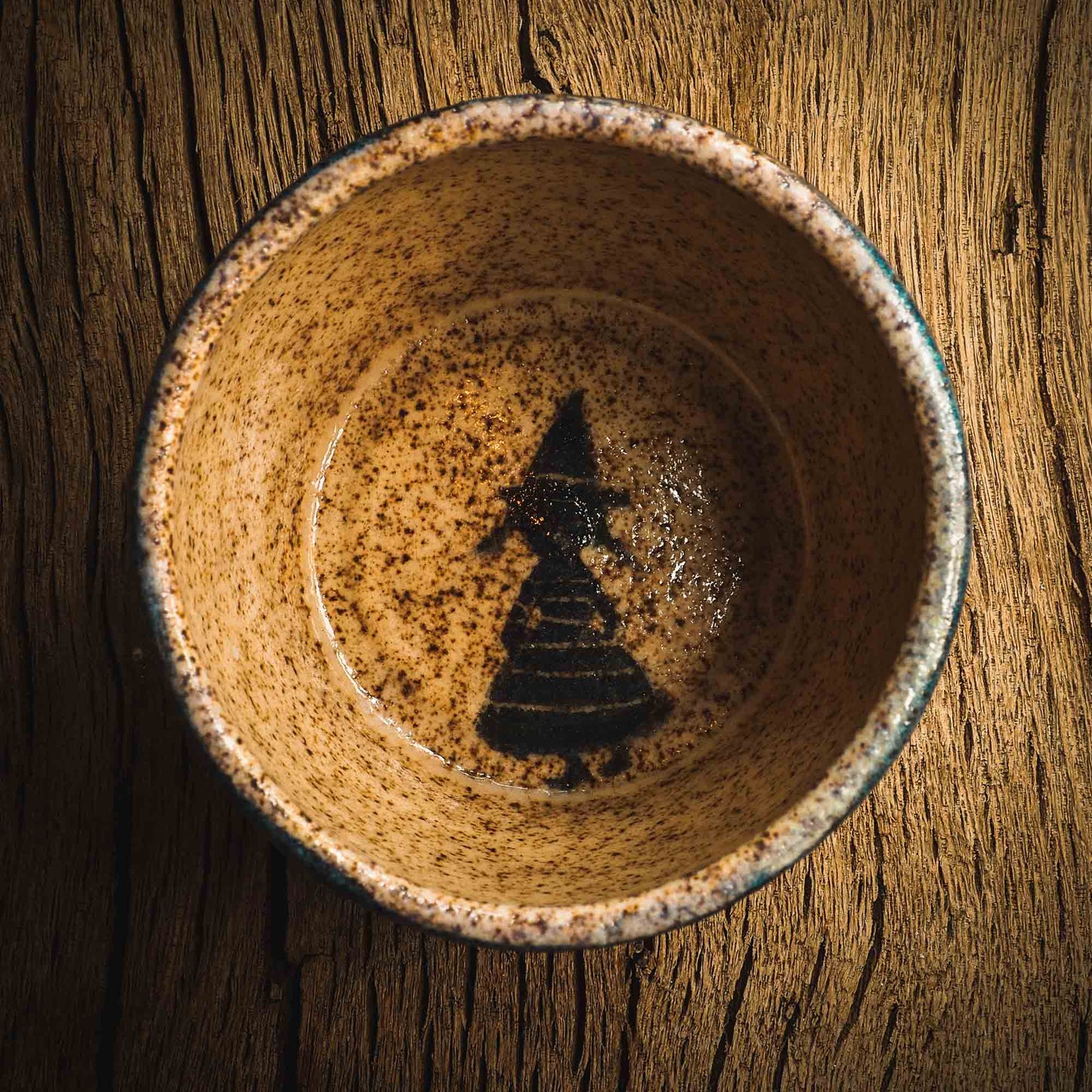 This little handmade ceramic halloween bowl by Idania Salcido Daita art has three witches carved on it, they are ready to cast a spell during a dark starry night, and you can see the magic stream from their wands in subtle bands of color across the deep, midnight blue sky. And of course, the moon and stars are there with them.