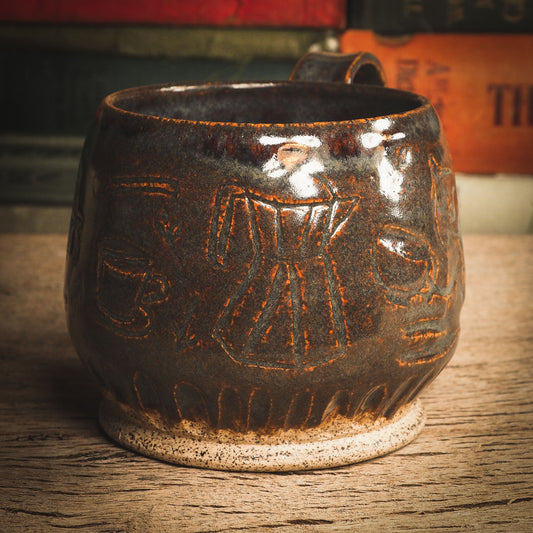 This super cute coffee mug has a little cat preparing his morning coffee carved on the sides of the mug and then glazed with beautiful earth tone glazes. An original ceramic coffee and tea mug by Idania Salcido, the artist behind Danita Art. It measures 3 x 3 x3 Inches, totally handmade in my studio. Food and drink safe, hand wash only.