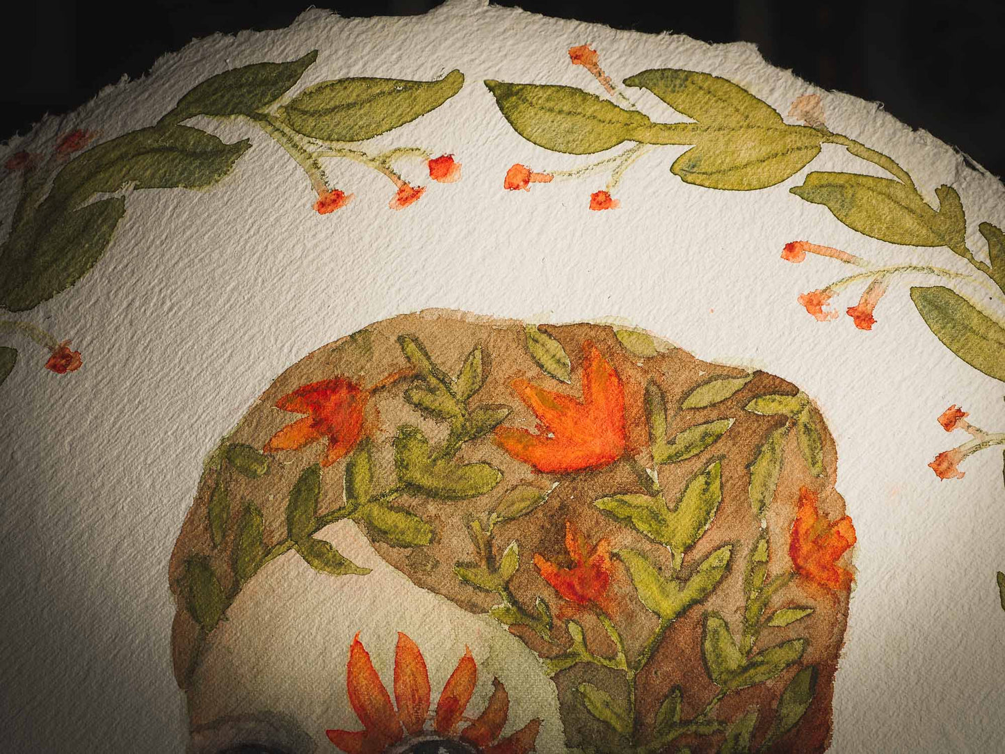 This original Idania Salcido (Danita Art) painting was made on a circular 12 x 12 Inch handmade watercolor paper, depicting a beautiful woman representing mother nature, with a wreath around it, orange flowers in her hair, a flower around her eye and a flying green bird at her shoulder.