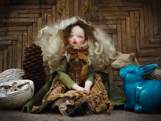 An original Danita handmade art doll, inspired by the sounds and smells of the Autumn forest, dry leaves and the colorful scenery of Mother Nature. Her name is TERRA, goddess of the earth and home to all of us. She is dressed in a beautiful hand made green dress and a brown lace apron that represent the life giving power of earth and plants.