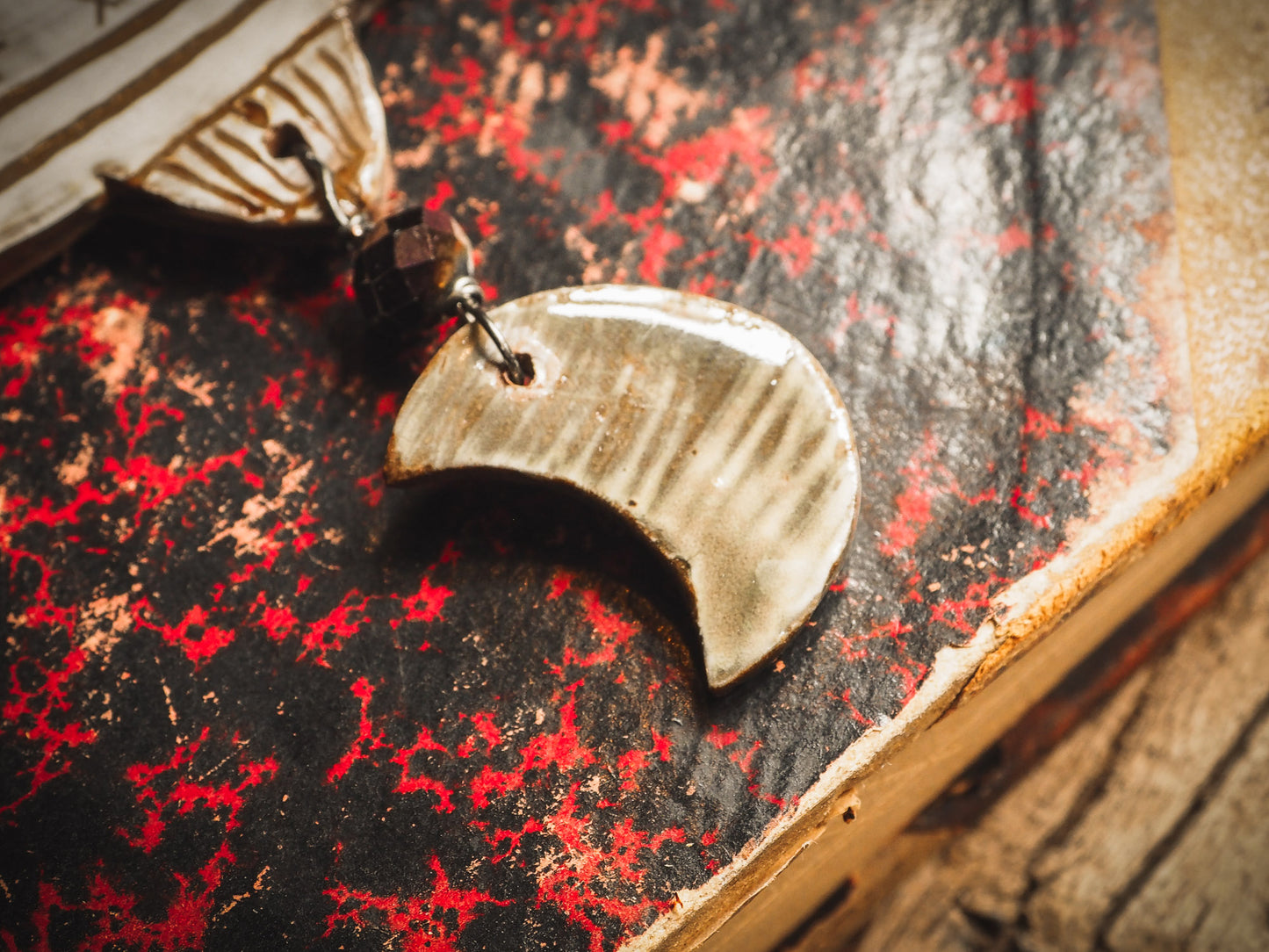 An original handmade Halloween ornament by Idania Salcido, Danita Art. Each ornament is hand carved with pumpkins, witches, cats, jack-o-lanterns and moons. Made with fired glazed ceramics, this little witch, jack-o-lantern and cat is carved with delicate patterns that make each ornament a one of a kind work of art.