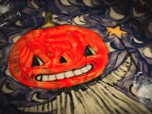An original handmade Halloween ceramic dinner plate by Idania Salcido, Danita Art. Each plate is hand painted and glazed with pumpkins, witches, cats, jack-o-lanterns and moons. Made with fired glazed ceramics, this little witch, jack-o-lantern and cat plate is painted with delicate patterns that make it one of a kind artwork.