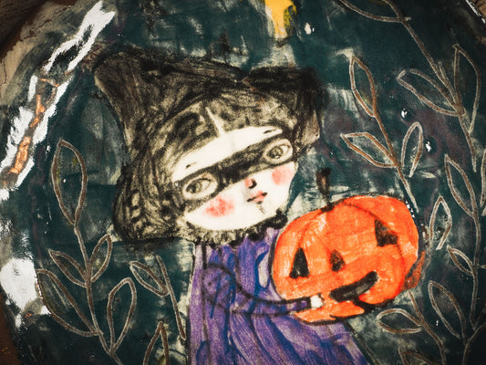 An original handmade Halloween ceramic dinner plate by Idania Salcido, Danita Art. Each plate is hand painted and glazed with pumpkins, witches, cats, jack-o-lanterns and moons. Made with fired glazed ceramics, this little witch, jack-o-lantern and cat plate is painted with delicate patterns that make it one of a kind artwork.