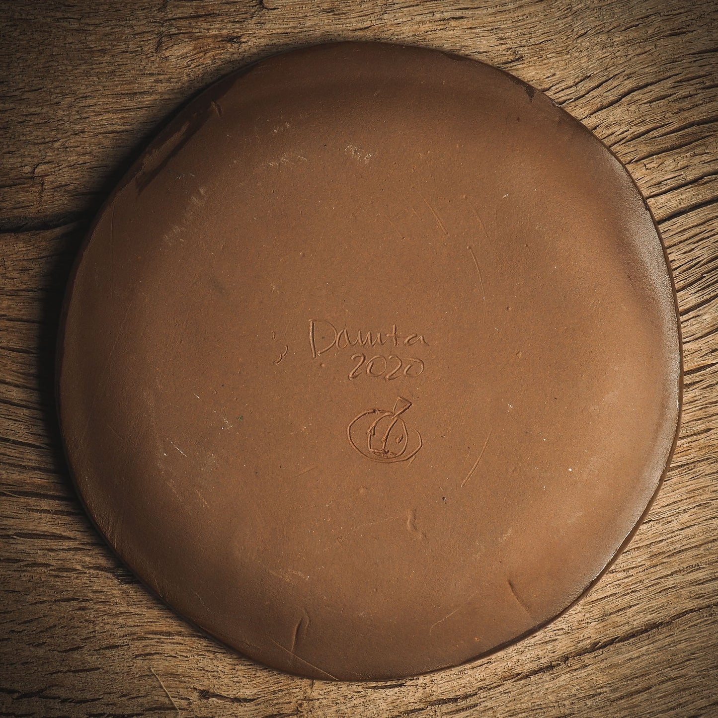 An original handmade Halloween ceramic dinner plate by Idania Salcido, Danita Art. Each plate is hand painted and glazed with pumpkins, witches, cats, jack-o-lanterns and moons. Made with fired glazed ceramics, this little witch, jack-o-lantern and cat plate is painted with delicate patterns that make it one of a kind artwork.