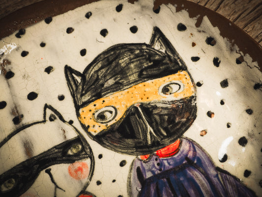 An original handmade Halloween ceramic dinner plate by Idania Salcido, Danita Art. Each plate is hand painted and glazed with pumpkins, witches, cats, jack-o-lanterns and moons. Made with fired glazed ceramics, this little witch, jack-o-lantern and cat plate is painted with delicate patterns that make it one of a kind artwork.