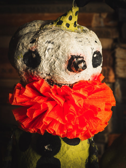 This adorable Halloween handmade ornament pumpkin jack-o-lantern doll monster by Idania Salcido, the artist behind Danita Art, is made with painted spun cotton and paper. It has hand painted face, teeth and eyes with a glittery paper had and matching paper costume. A Halloween home decoration on trick-or-treat night.