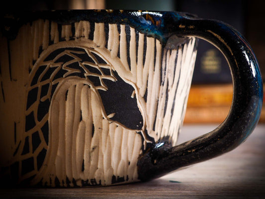 An original Halloween ceramic mug tumbler bowl handmade by Idania Salcido the artist behind Danita Art. Made with wheel thrown clay hand carved and glazed by the artist. Witches, ghosts, goblins, black cats, vampires give a folk art primitive feel to it. Perfect for Halloween Candy, ice cream and fruit, a pet cat bowl.